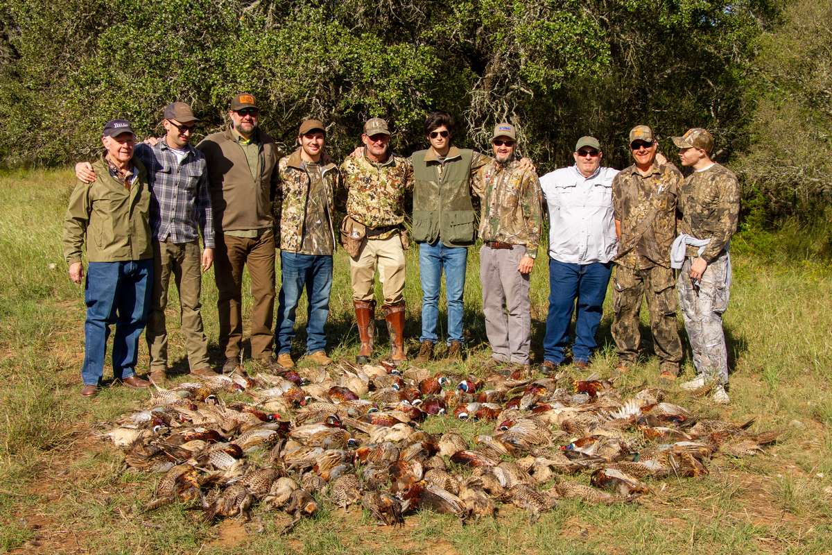 Happy group of hunters after an outstanding day Continental Pheasant Shoot in Texas